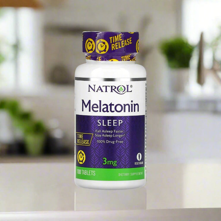 The front image of natrol melatonin time release 3mg is placing on table